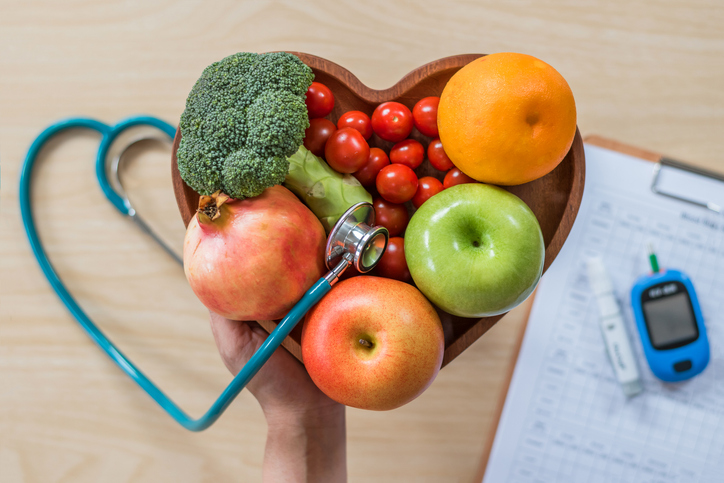 A stethoscope and healthy food symbolize awareness for type 2 diabetes